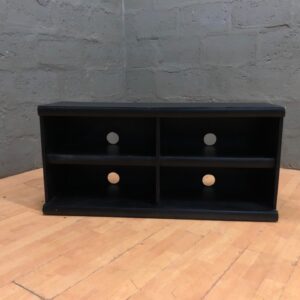 Black low media shelf / TV unit — 4 cubbies, cable holes, 58 x 36 x 120 (used)