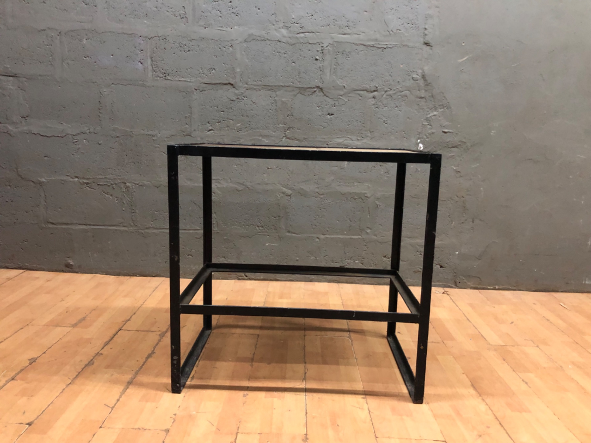 Industrial black metal-frame side table with solid wood top — 80 x 51 x 81 cm