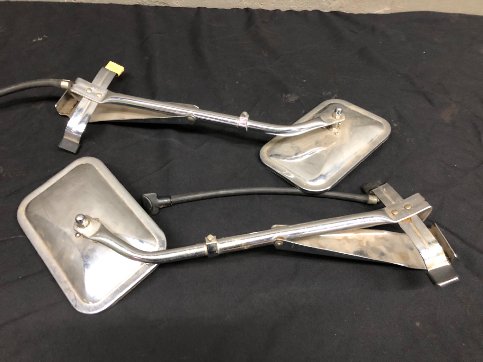 Pair of adjustable clamp-on chrome vehicle side mirrors — used, fair condition