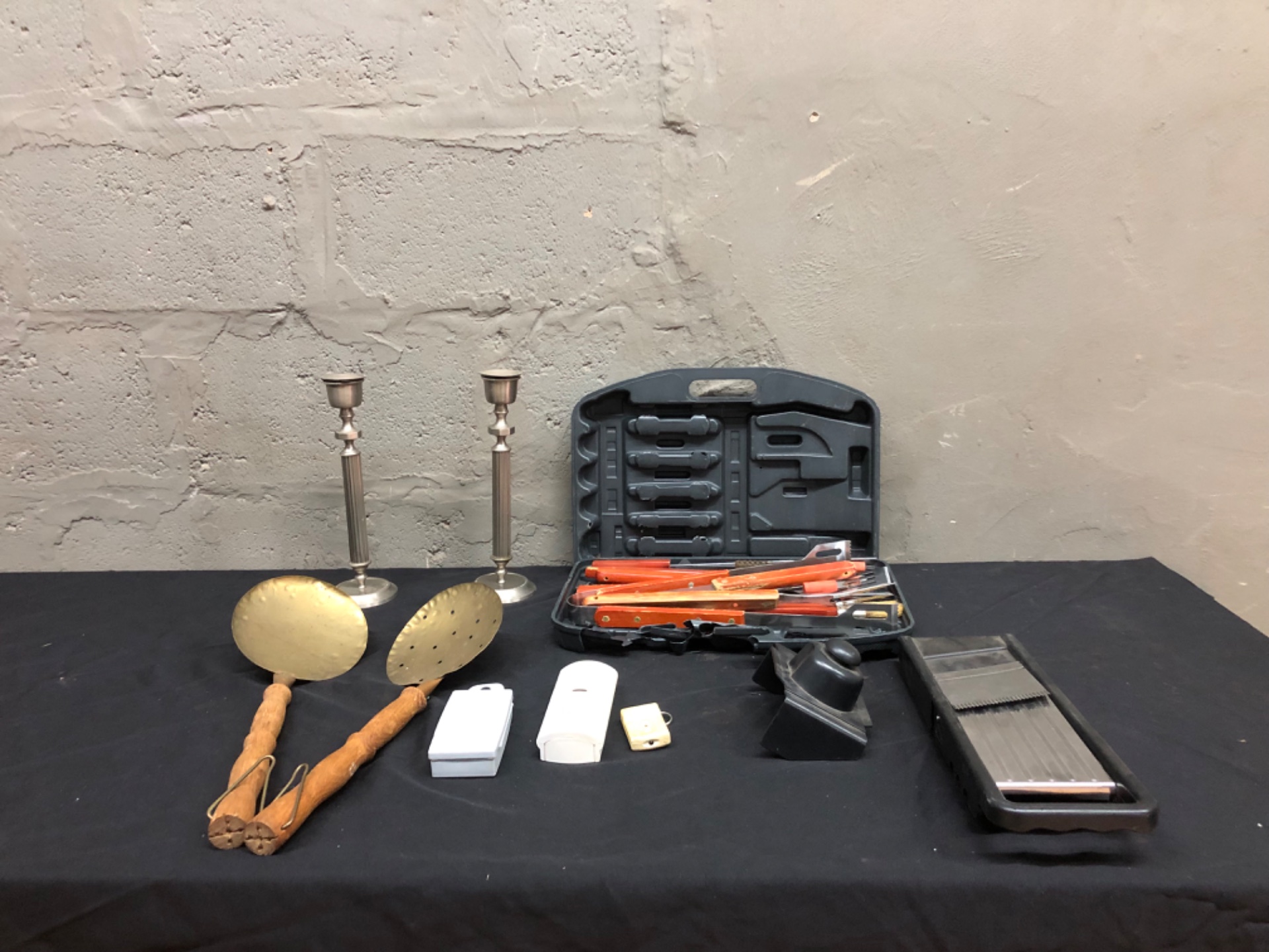 Assorted household & BBQ tool lot — orange-handled BBQ kit (case damaged), mandoline, brass skimmers, candlesticks, alarm parts