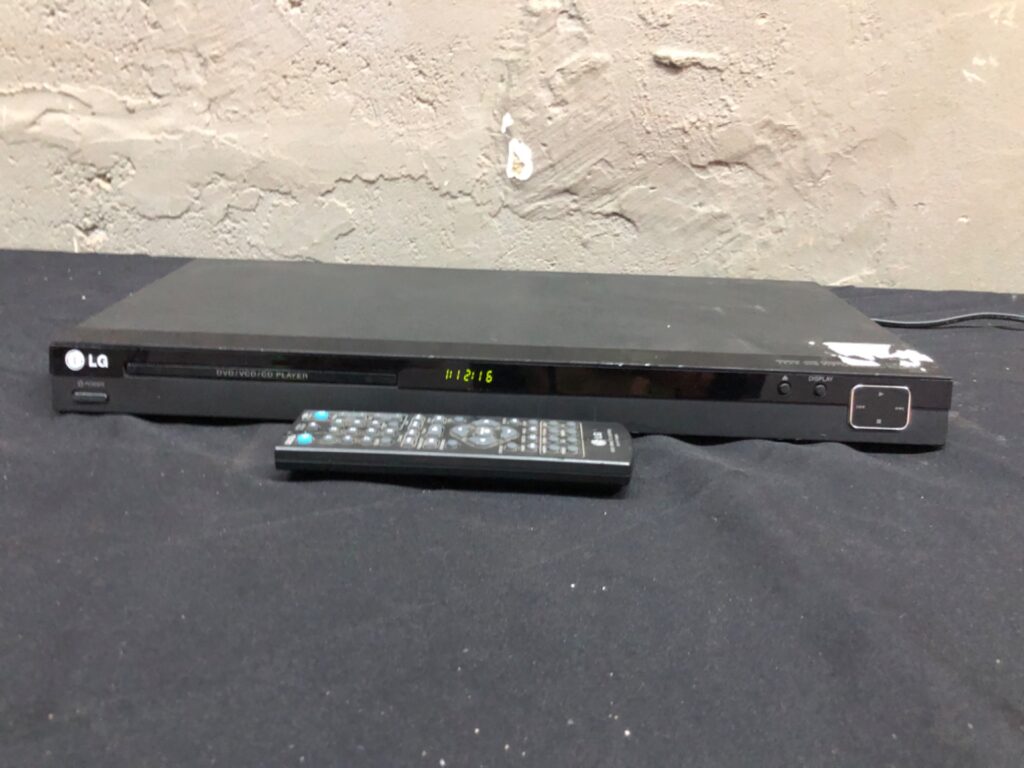 LG DVD Player — powers on, tray opens & plays, power lead + one tested remote (cosmetic wear)