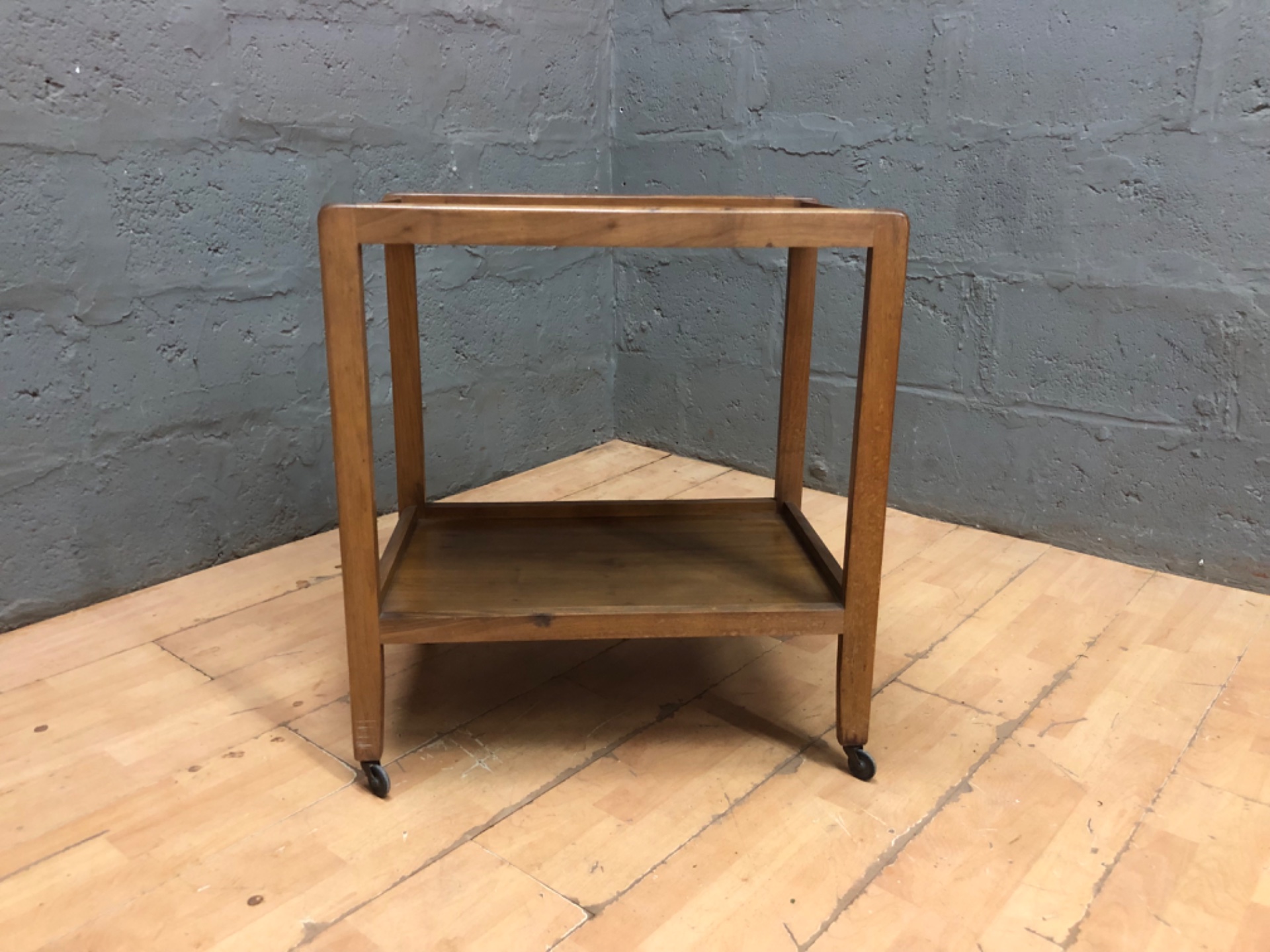 Compact wooden two-tier side table / trolley on castors