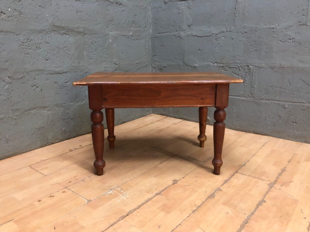 Small solid-wood low / coffee table with turned legs — rustic, worn patina