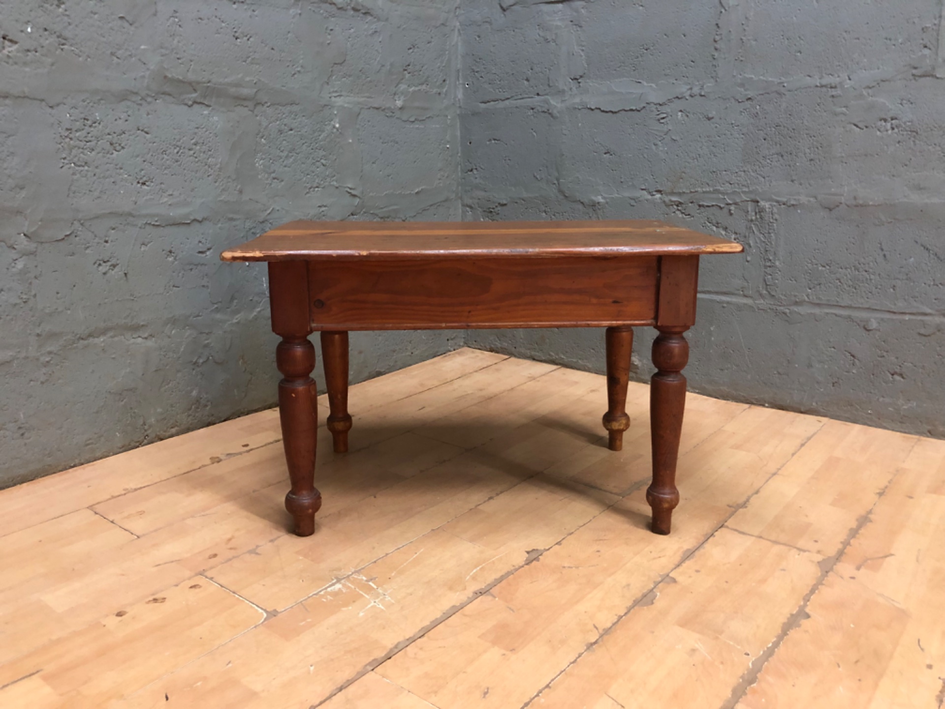 Small solid-wood low / coffee table with turned legs — rustic, worn patina