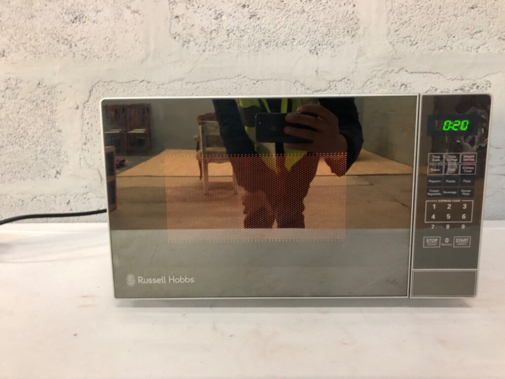 Russell Hobbs RHEM21L Countertop Microwave — Powers On, Mirrored Front, Heavy Interior Staining & Rust