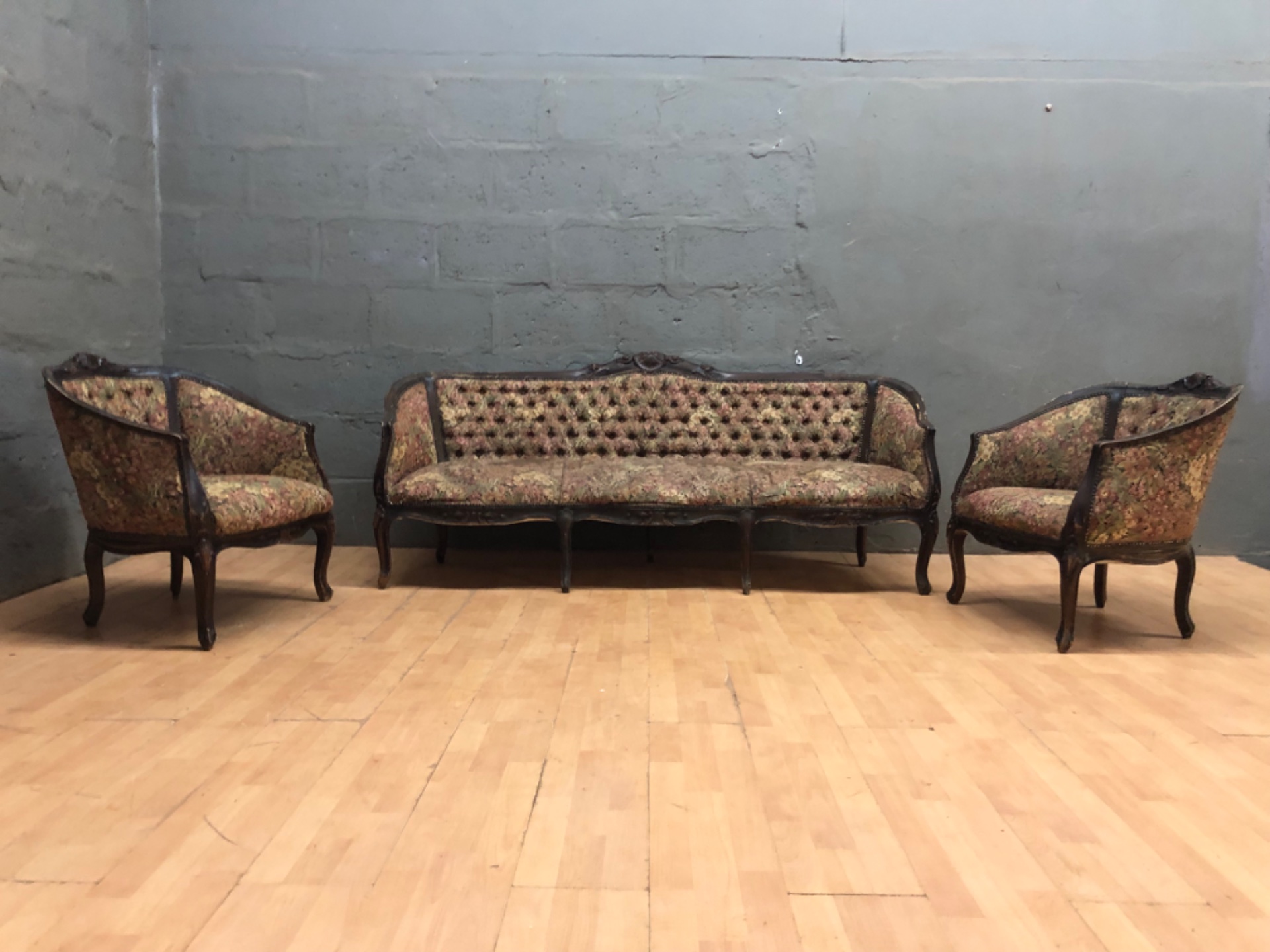 Carved timber 3-piece upholstered suite (3‑seater + 2 tub chairs) — floral tufted tapestry, nailhead trim