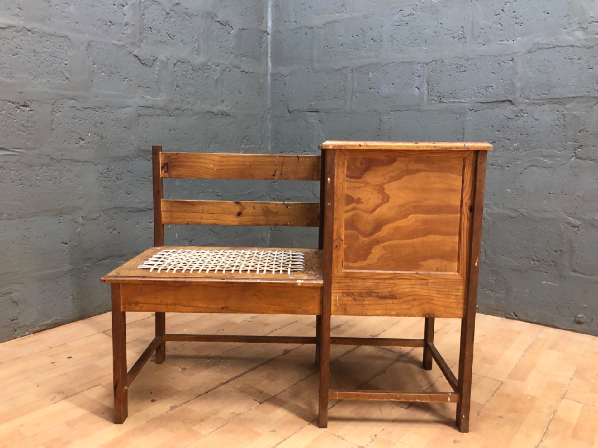 Wooden hall / telephone bench with storage cubby and woven seat – rustic, well-worn