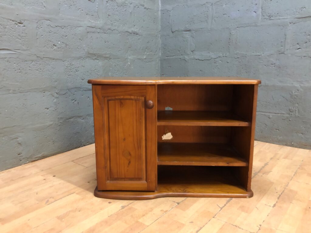 Small pine‑coloured side cabinet — single door, three open shelves, solid & stable