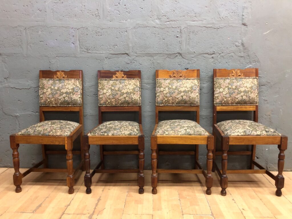 Set of 4 carved-back wooden dining chairs — floral upholstery, turned front legs