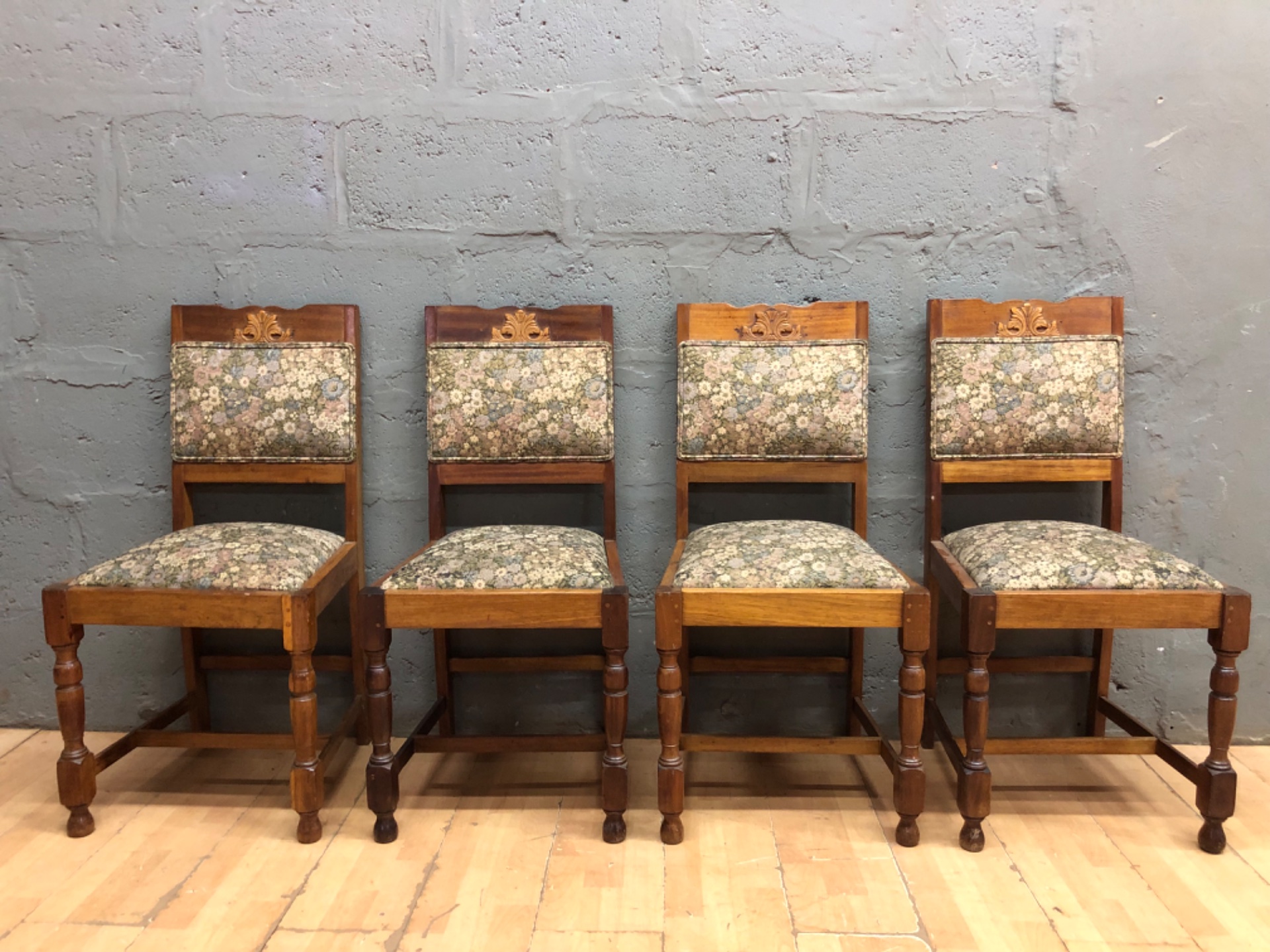 Set of 4 carved-back wooden dining chairs — floral upholstery, turned front legs