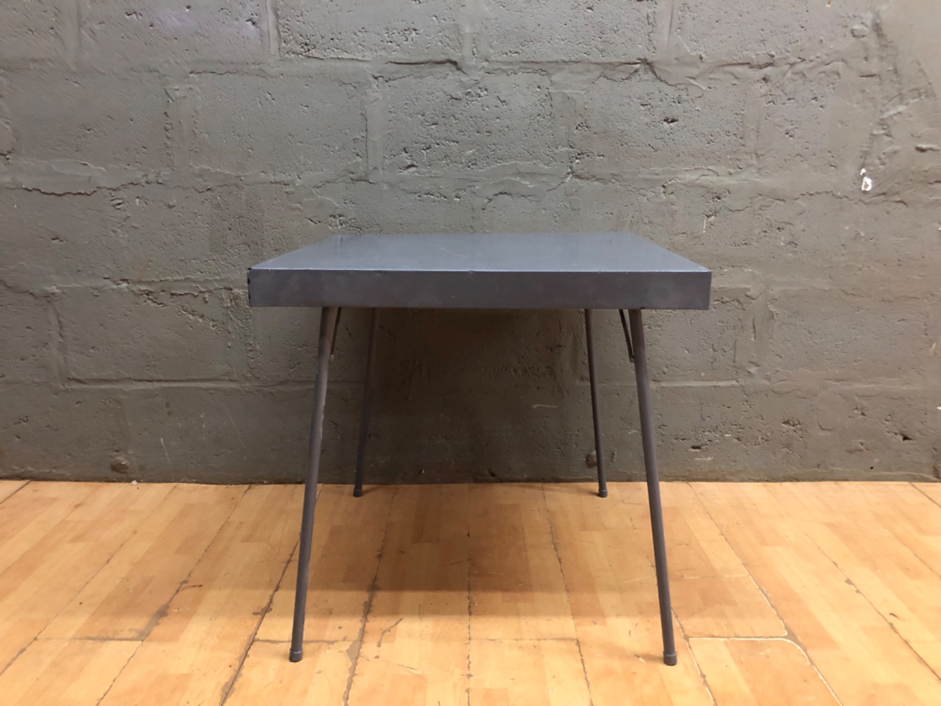 Square folding table 90 × 90 × 58 cm — grey painted top, metal folding legs