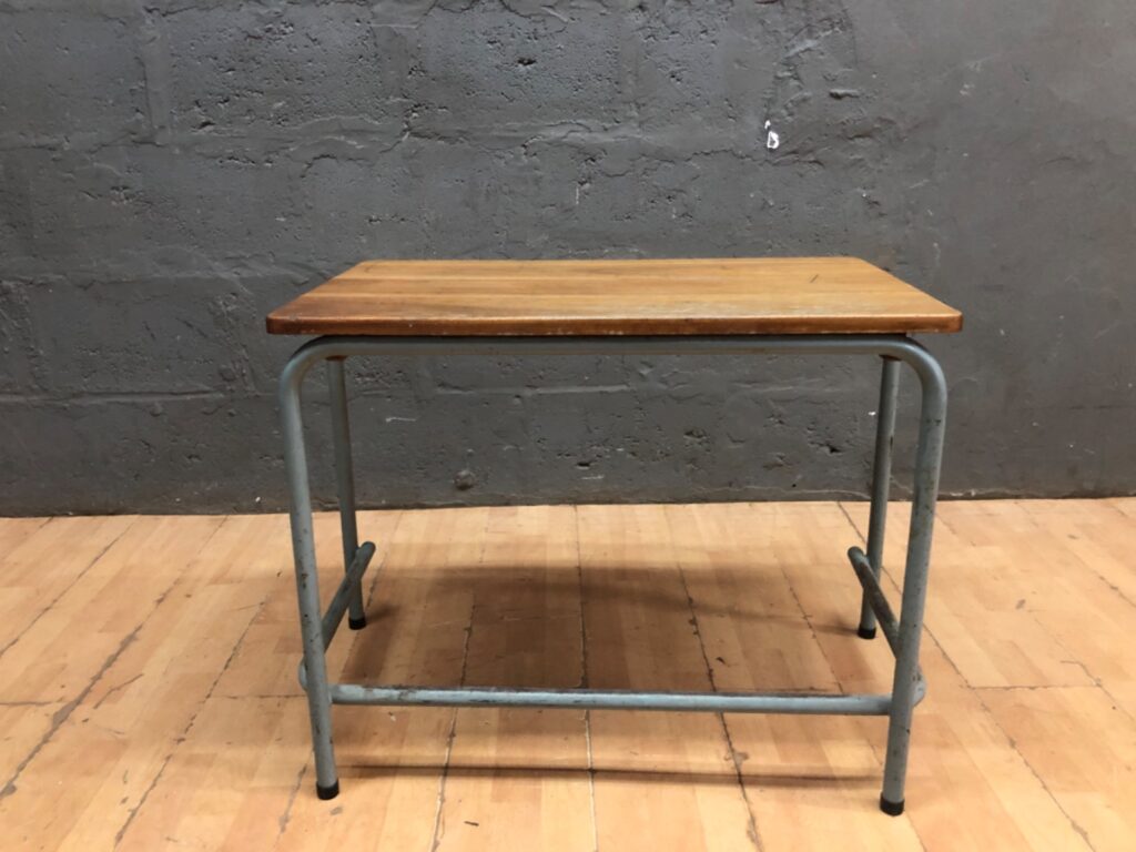 Small school / industrial-style desk with solid wooden top and tubular steel frame