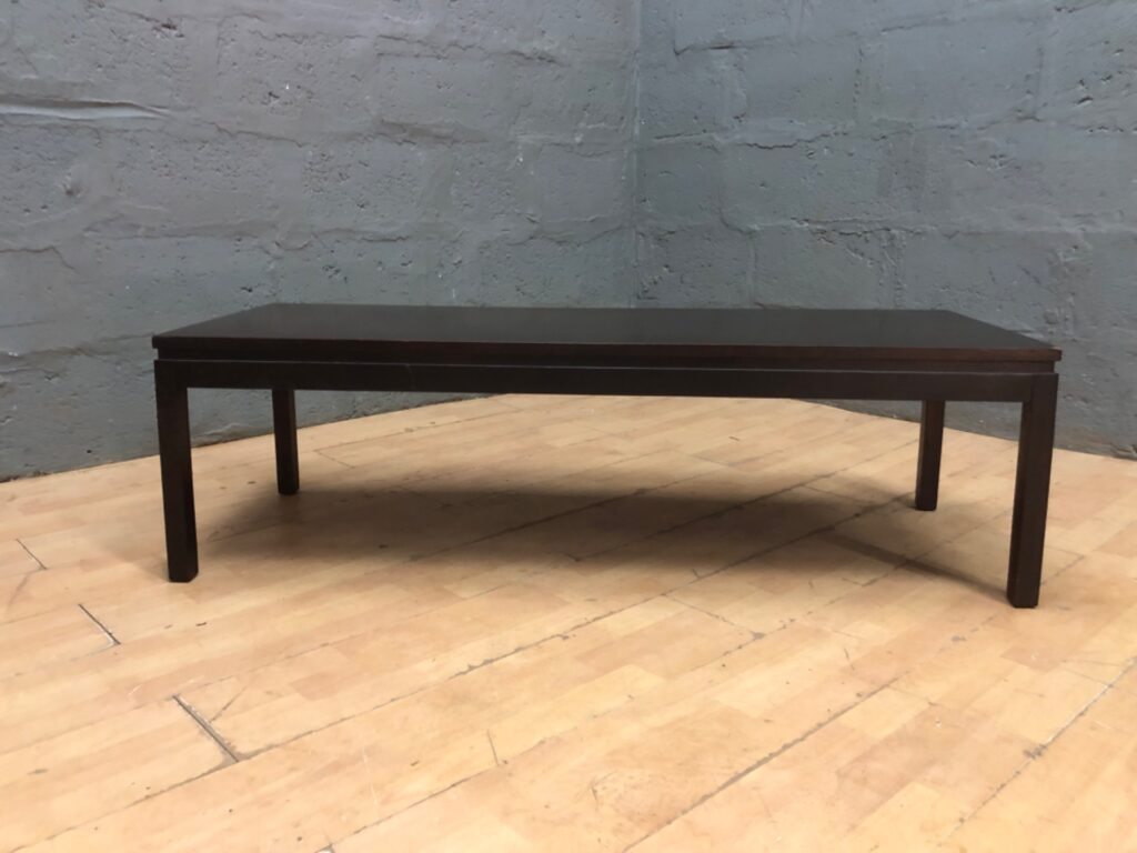 Low rectangular coffee / occasional table — dark finish, 137 × 51 × 41 cm — surface crazing and corner chip