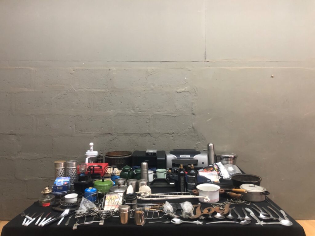 Mixed household & kitchenware lot — 64 items incl. 2 Epson printers, cast-iron pans, enamel mugs, utensils, tins, gas canisters (used)