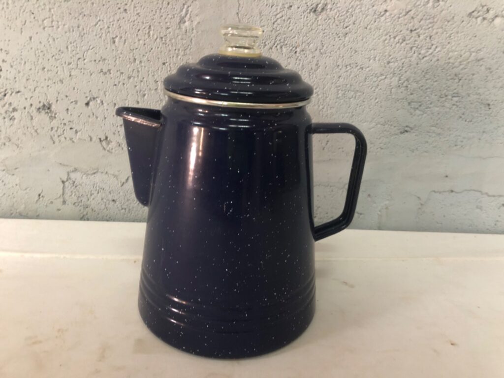 Dark blue speckled enamel coffee / tea pot with glass-knob lid — used, chips to spout & trim