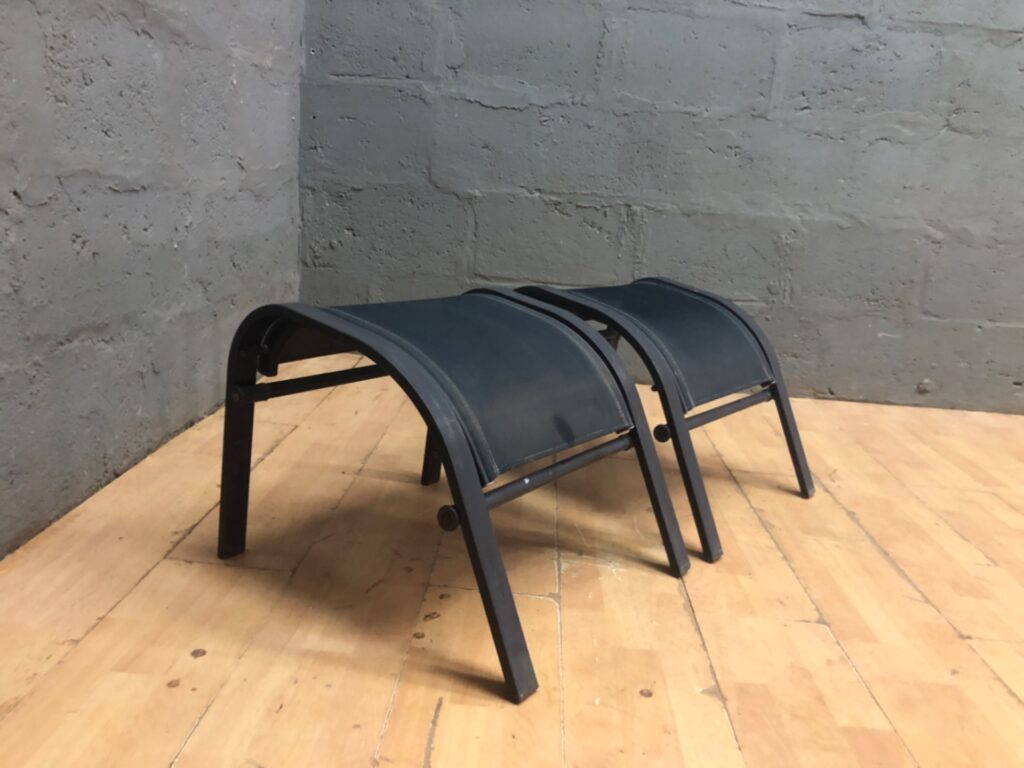 Pair of Outdoor Sling Footstools / Ottomans — Dark Metal Frames, Curved Sling Seats