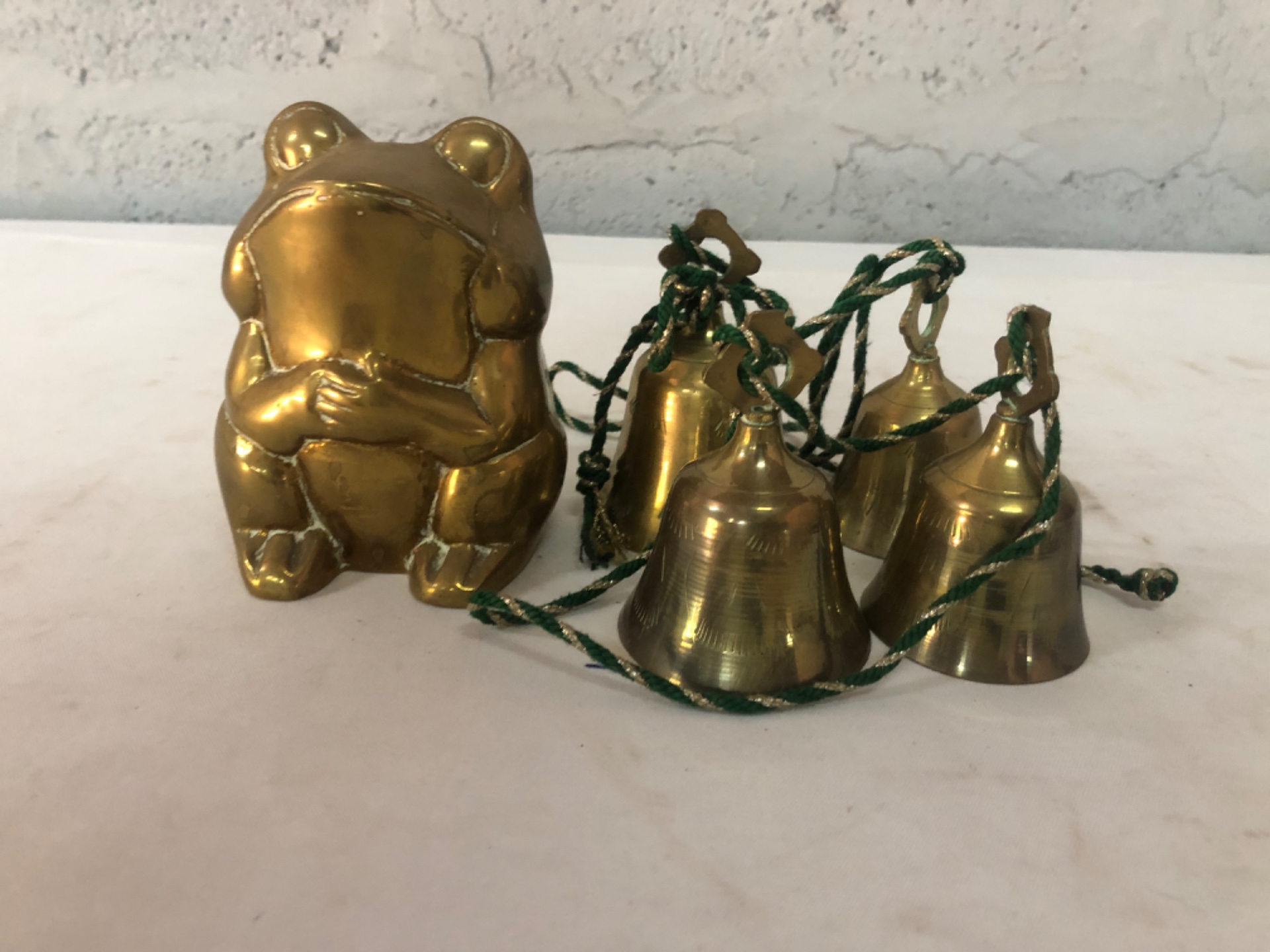 Brass frog figurine with set of five small hanging brass bells – decorative set, used condition
