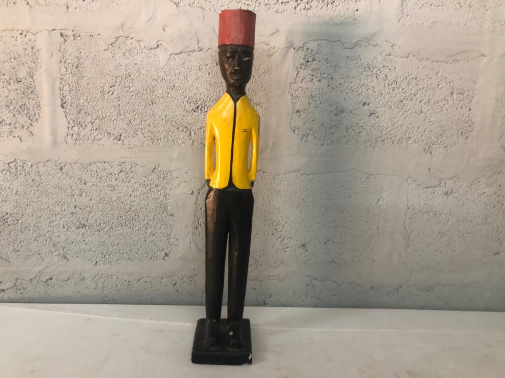 Carved painted wooden standing figure – 61 cm, yellow jacket & red hat (decorative)