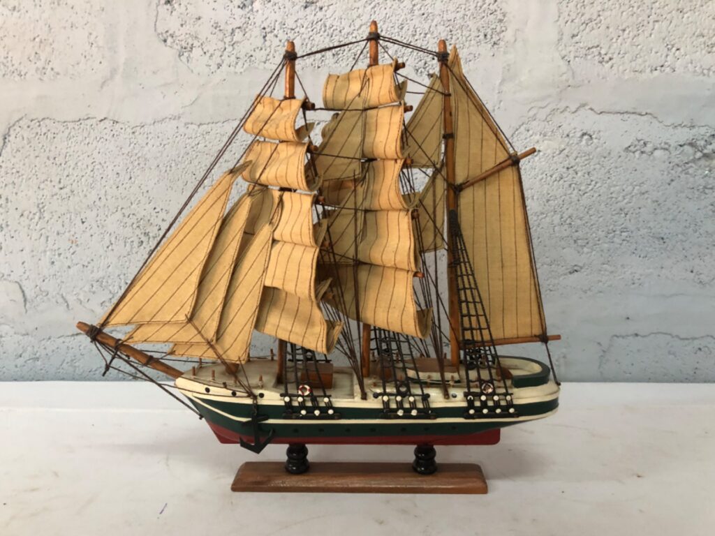 Decorative Three‑Masted Wooden Model Ship on Stand — Fabric Sails, Visible Wear