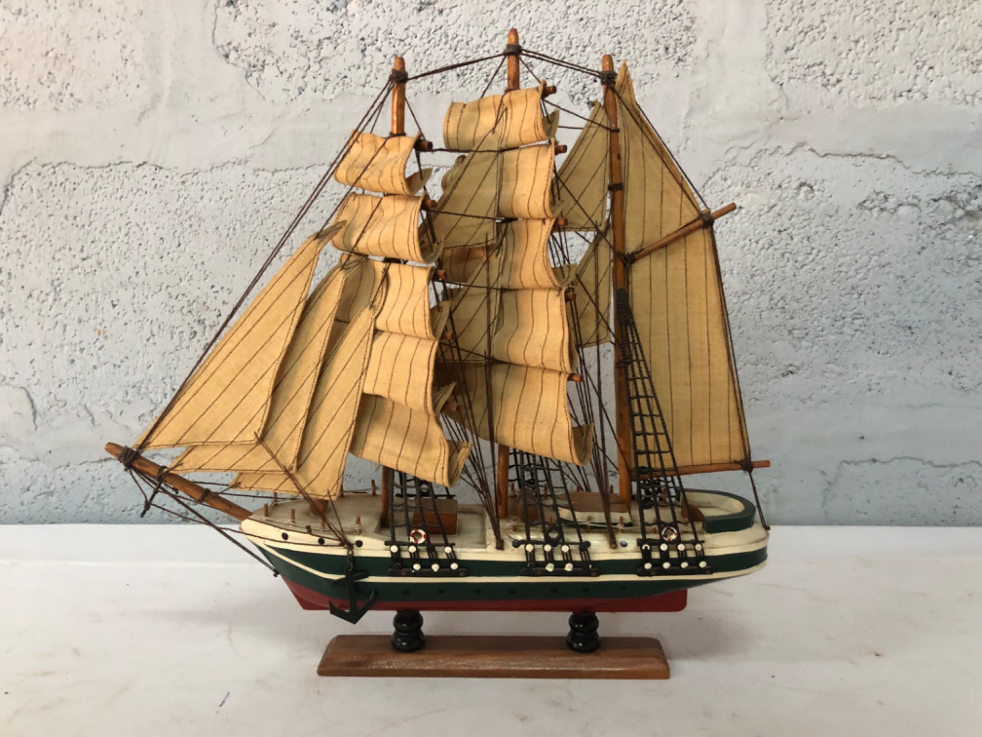 Decorative Three‑Masted Wooden Model Ship on Stand — Fabric Sails, Visible Wear