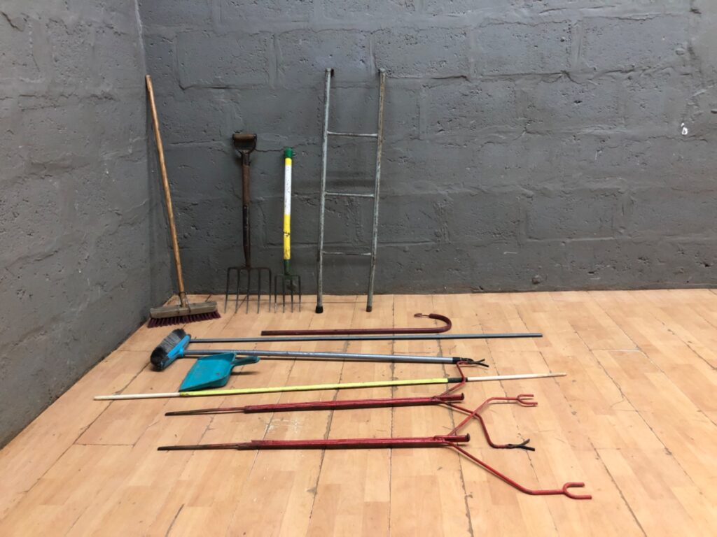 Mixed lot of 11 garden hand tools — broom, dustpan, forks, small ladder & assorted poles (used)