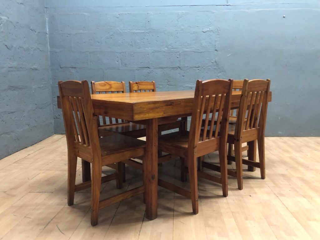 Solid-wood 7-piece dining set — table + 6 chairs, 173 x 101 x 78 cm (used, repaired corner)