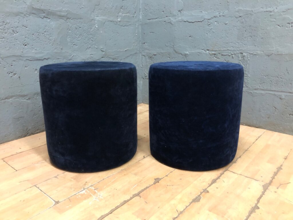 Pair of navy velvet cylindrical pouffe stools — 50 H x 48 Ø cm (each) — used, stained