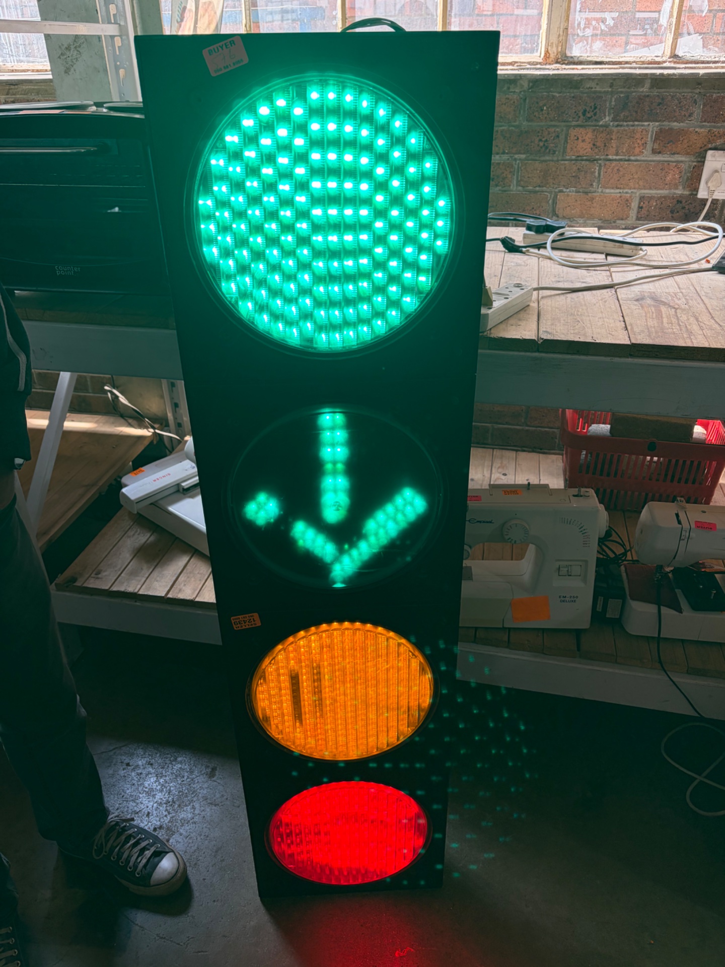 Vertical LED Traffic Signal (3‑section) — green round & arrow, amber, red — powers on in photos