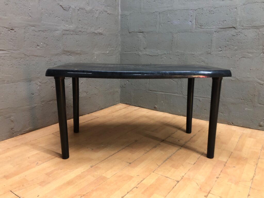 Low black plastic table 132 x 82 x 70 cm — used, scratches & small chip