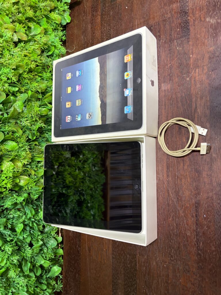 Apple iPad (original-style) with box — 30‑pin cable visible, screen untested, box worn
