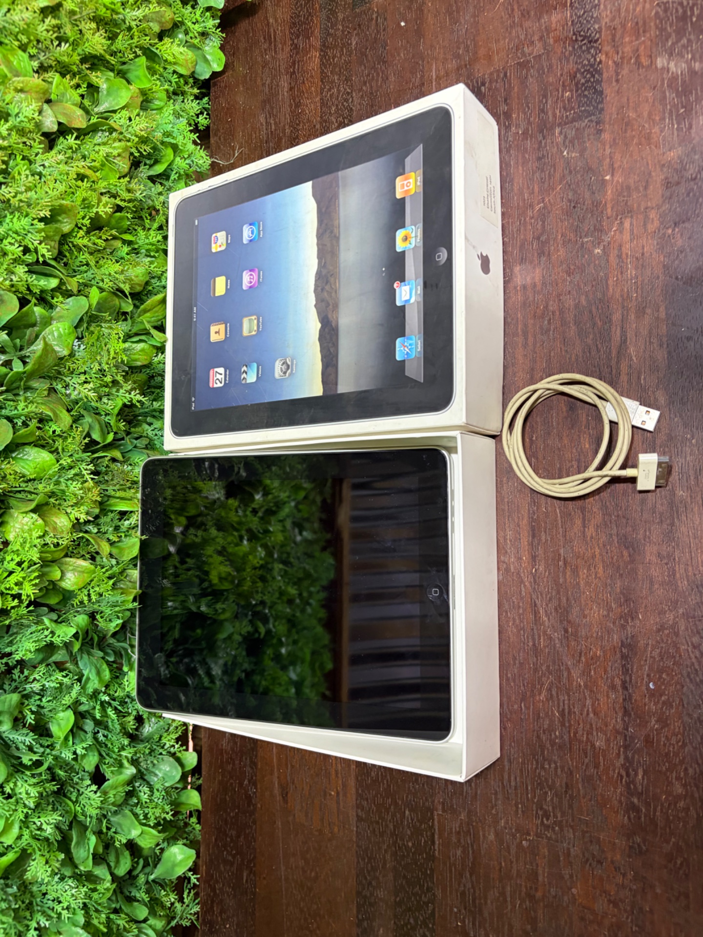 Apple iPad (original-style) with box — 30‑pin cable visible, screen untested, box worn