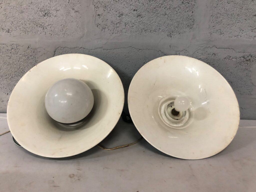 Pair of green enamel industrial pendant lamps — white interior, one tested lit (one not working)
