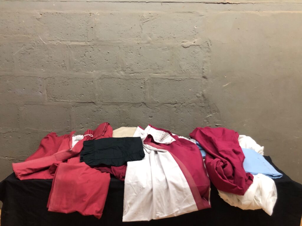 Lot of 19 assorted curtain panels & linens — red, white, blue pieces with lace panel and pencil-pleat headers