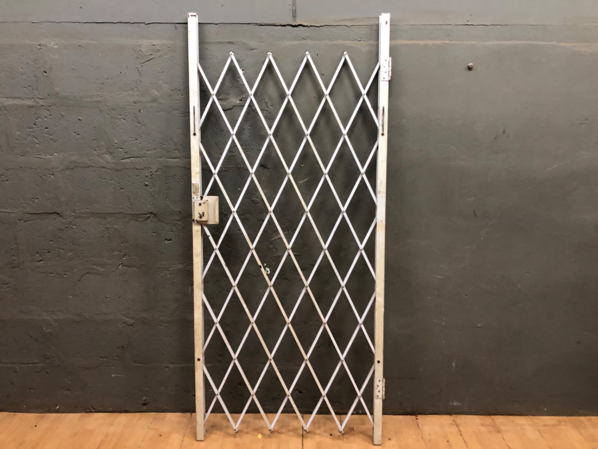 Collapsible metal security gate — 201 cm H x 90 cm W, lock tested, brackets included