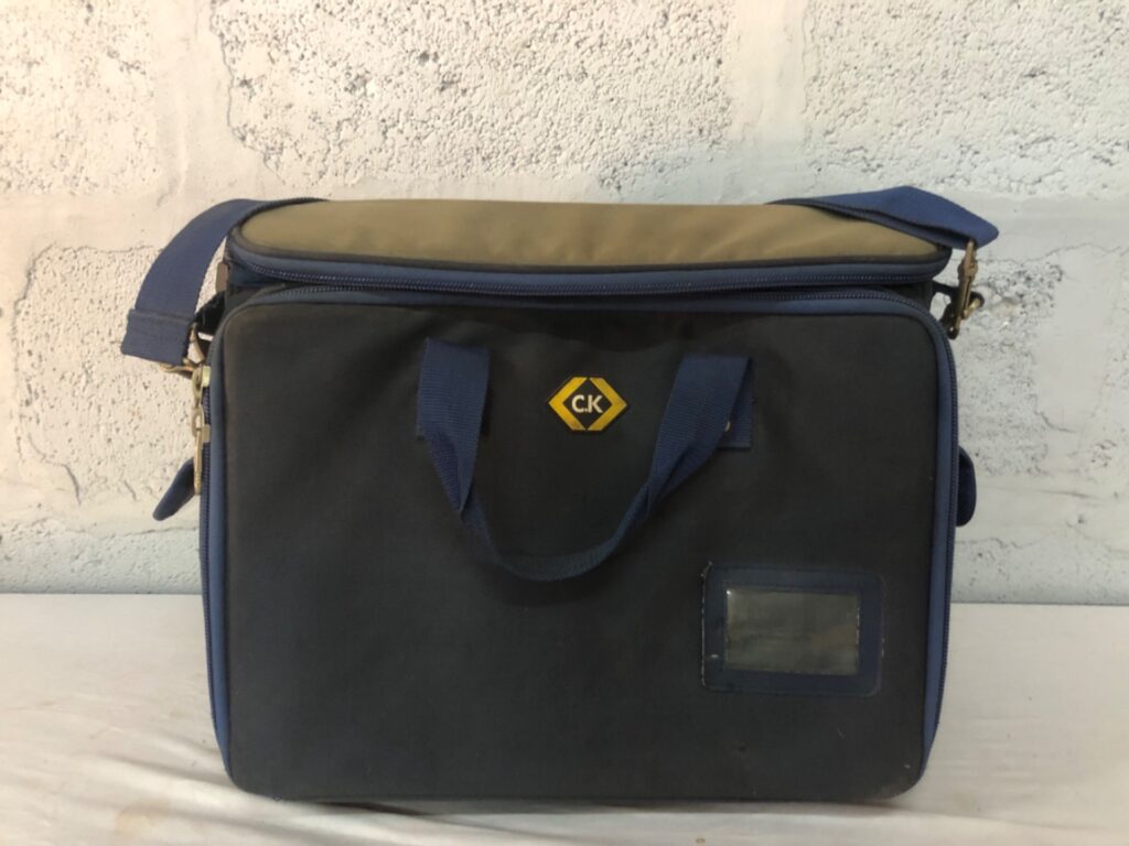 C.K soft-sided tool organiser / shoulder bag — padded main, front organiser pockets (used)