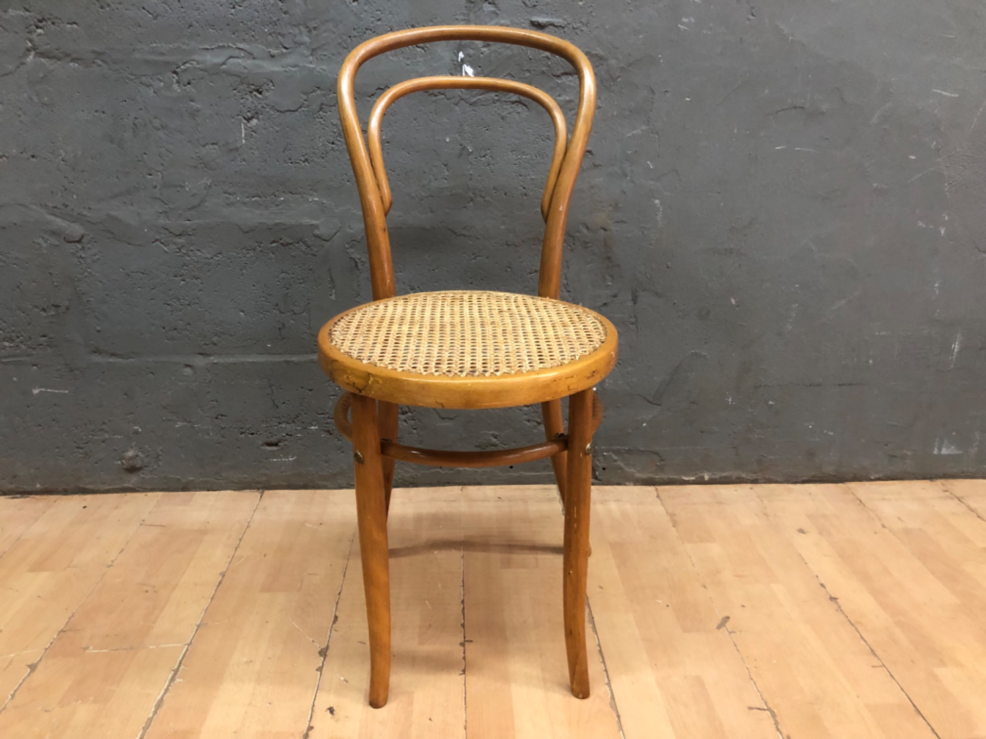 Vintage bentwood cane‑seated chair — solid frame, damaged cane & split front seat rim