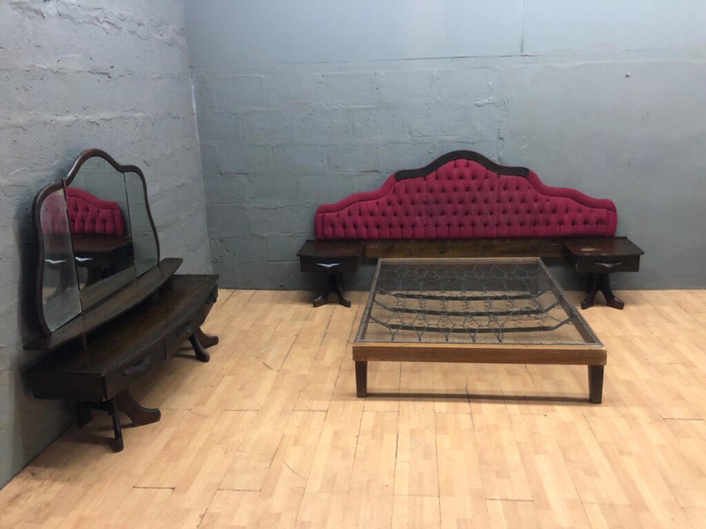 Vintage tufted upholstered double bed suite with metal spring base, attached bedside tables and tri-fold mirror dressing table