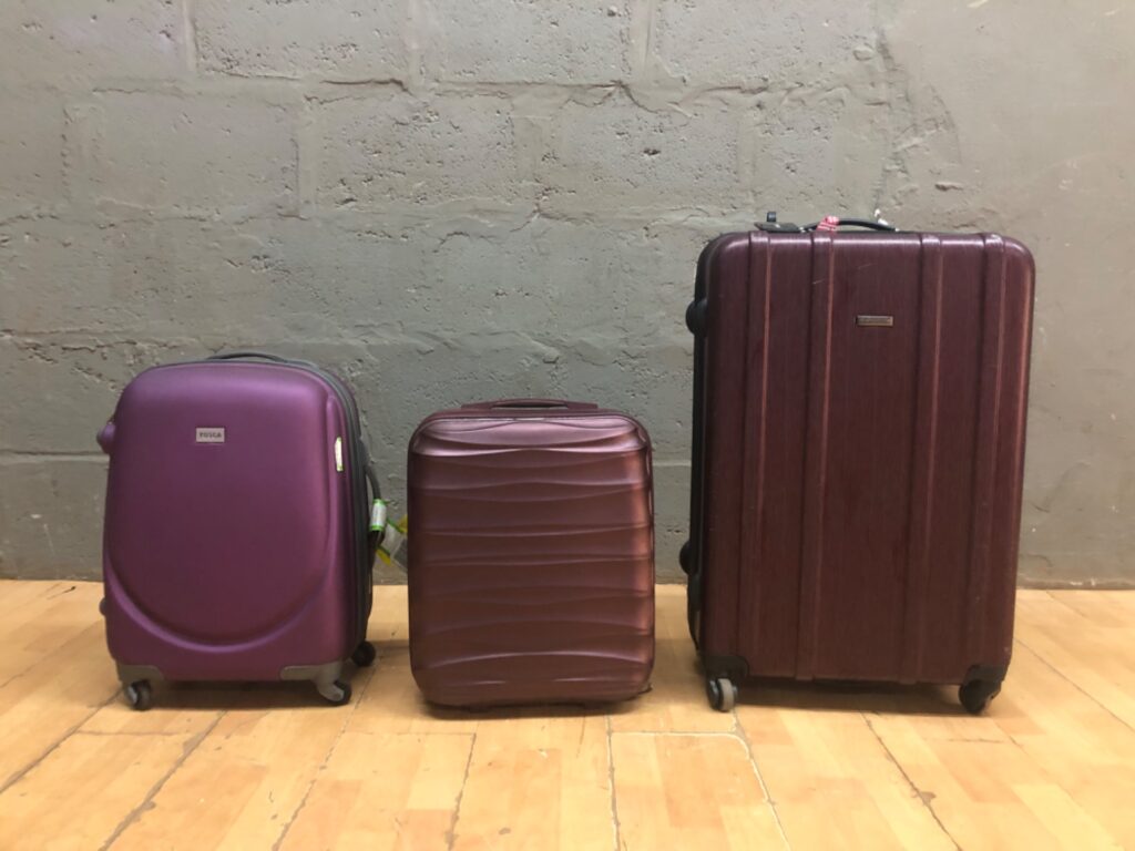 Three-piece hard-shell luggage set — mixed brands (TOSCA, members, E CELLINI) — used, wheels worn