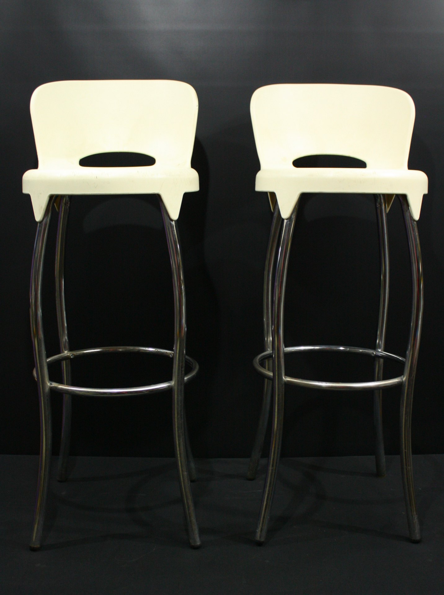 Pair of white plastic-seat chrome bar stools — approx 1m legs, used condition
