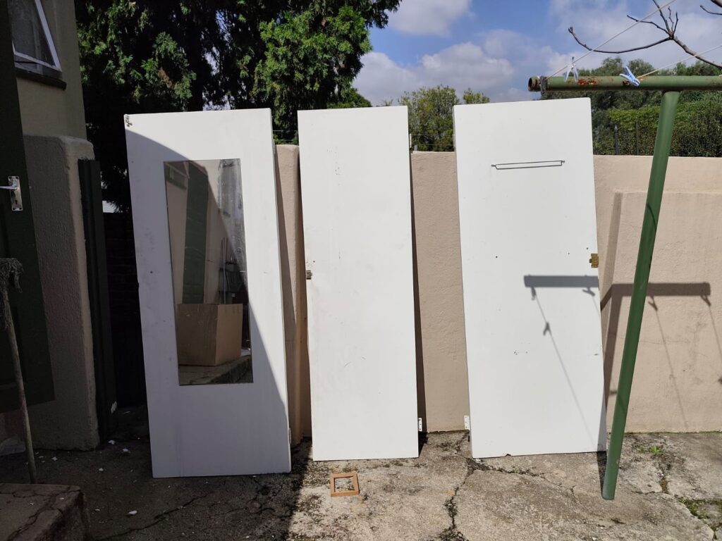 Lot: Three used white interior doors — one with full-length mirror inset