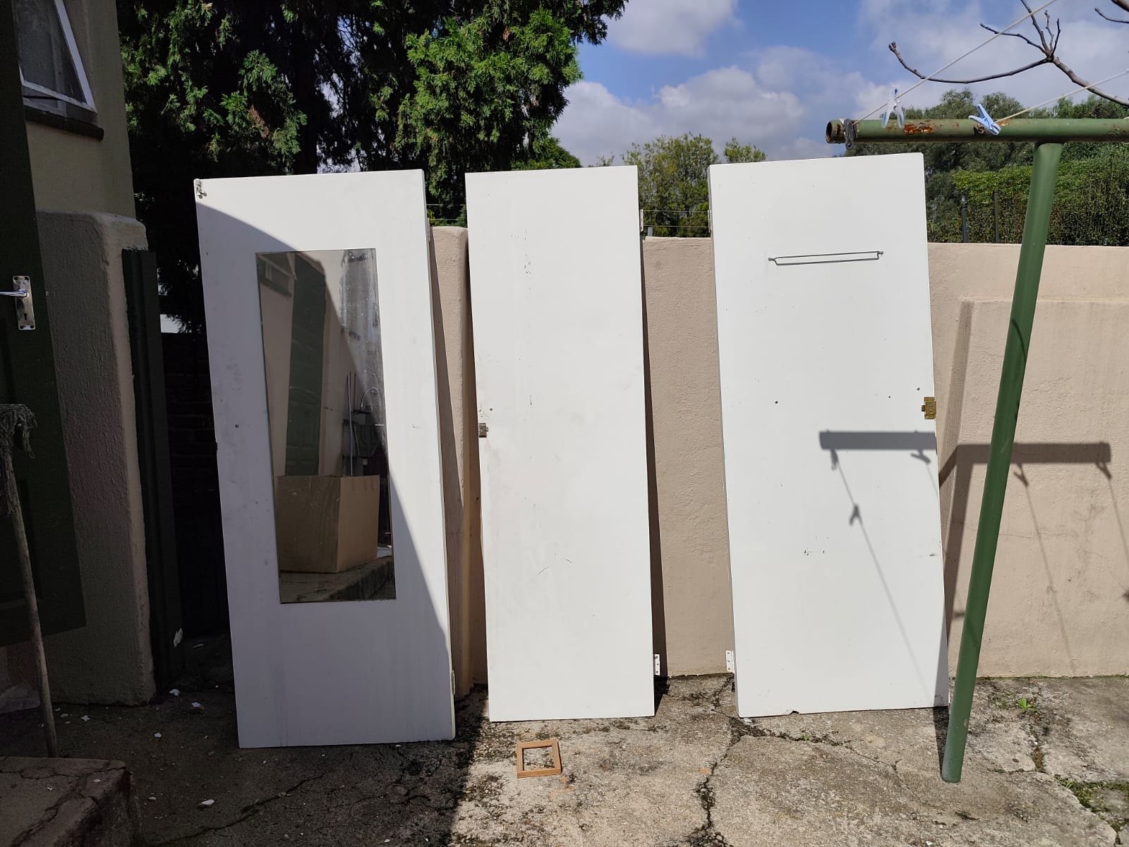 Lot: Three used white interior doors — one with full-length mirror inset