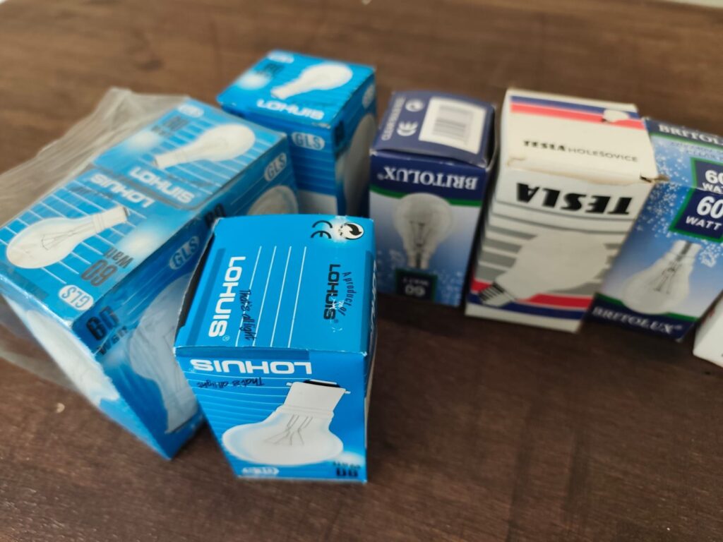 Mixed lot of assorted light bulbs — Lohuis, Britolux, Tesla, Lexman, PowerUp; some sealed, some loose/reflector bulbs