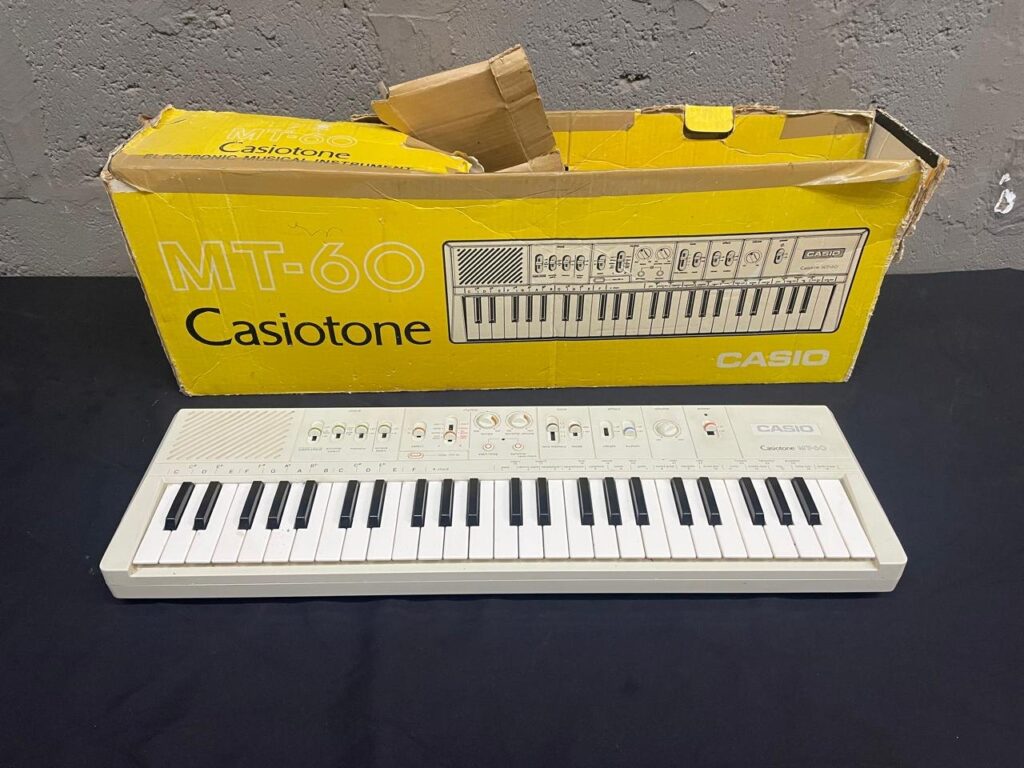 Casio Casiotone MT-60 vintage electronic keyboard with original yellow box (for spares / repairs)