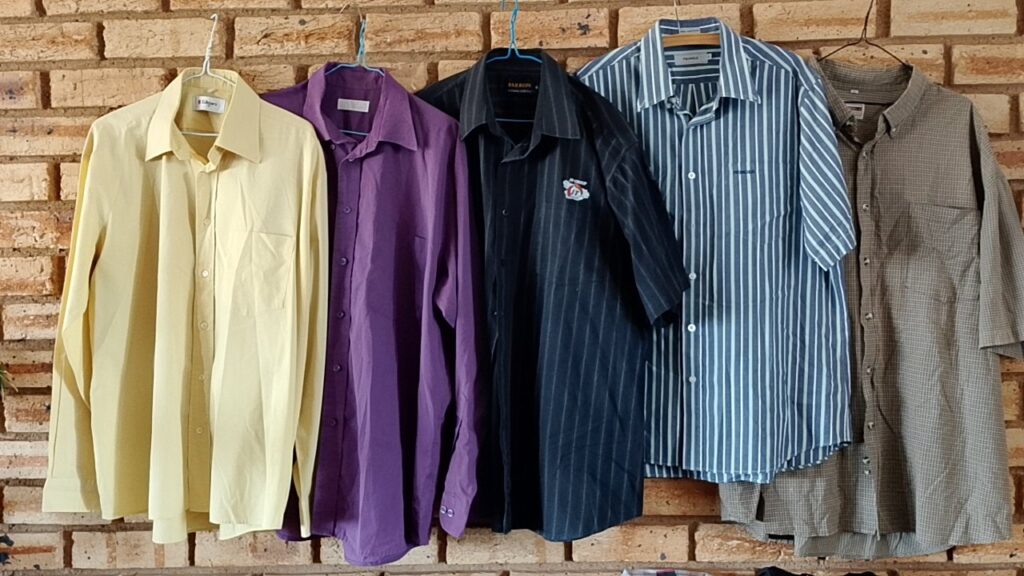 Lot of 14 assorted men’s shirts, jersey and trousers — mixed brands, used (trouser needs new zip)