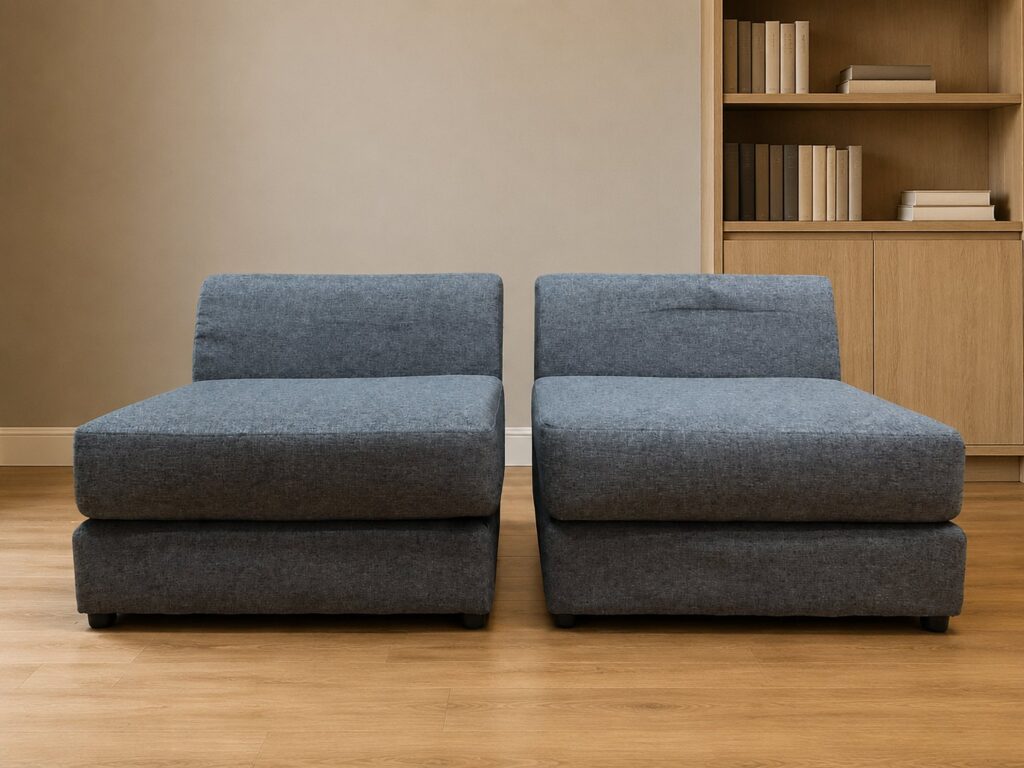 Pair of armless modular sofa sections — blue‑grey fabric, fully removable covers