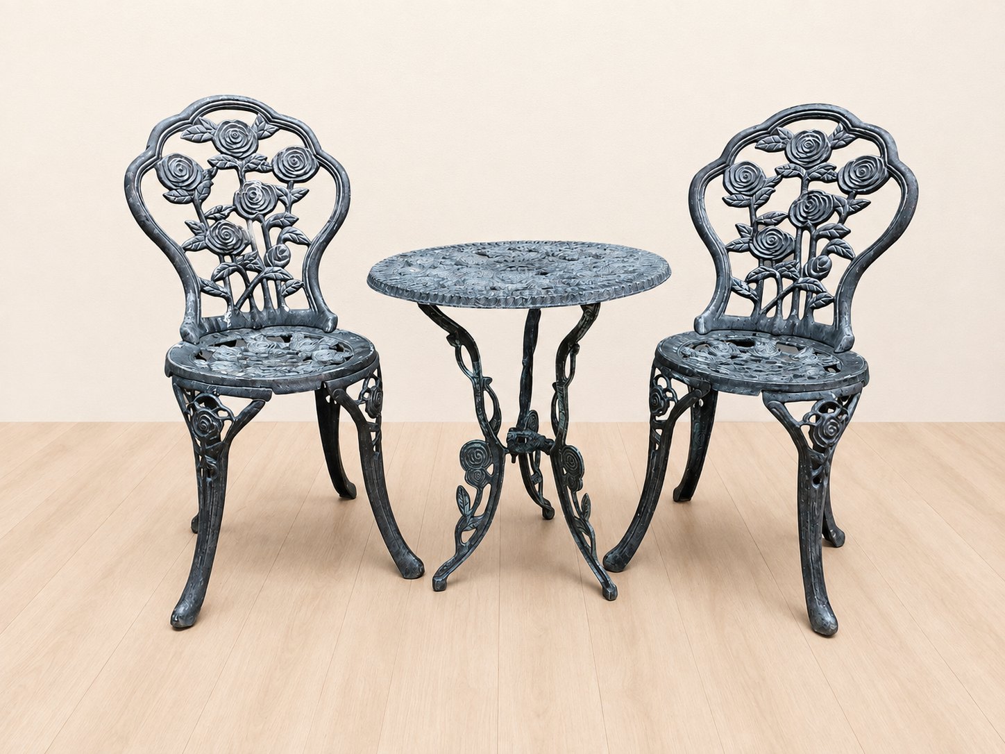 3-piece cast‑aluminium outdoor bistro set — round rose‑motif table + 2 chairs