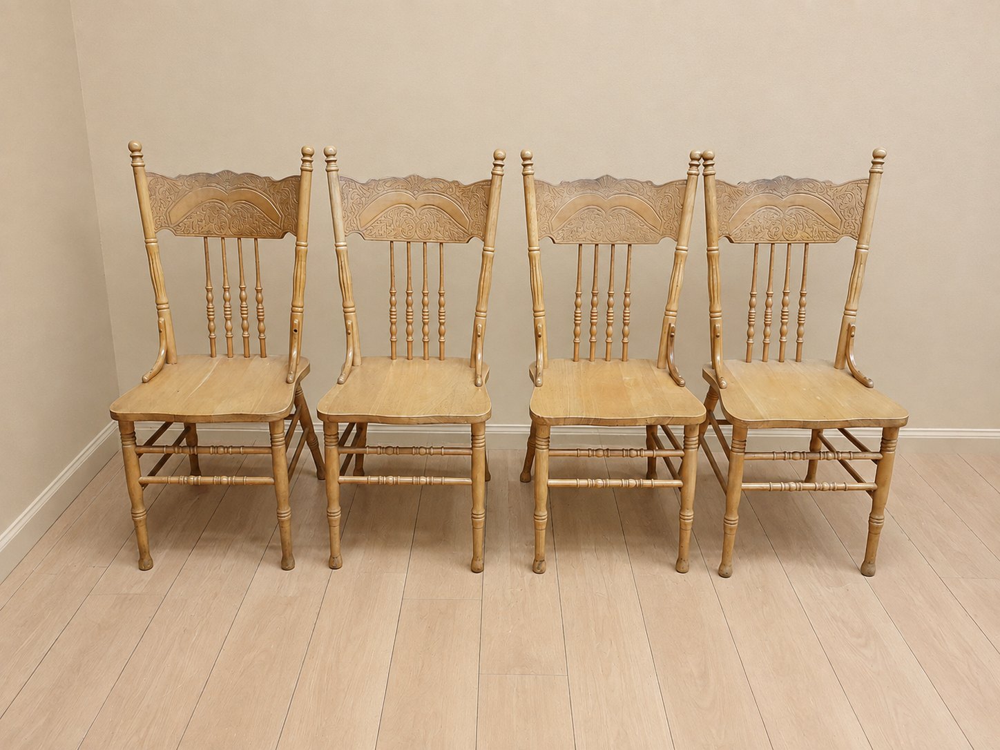 Set of 4 carved wooden dining chairs – tall carved backs, turned spindles, solid seats