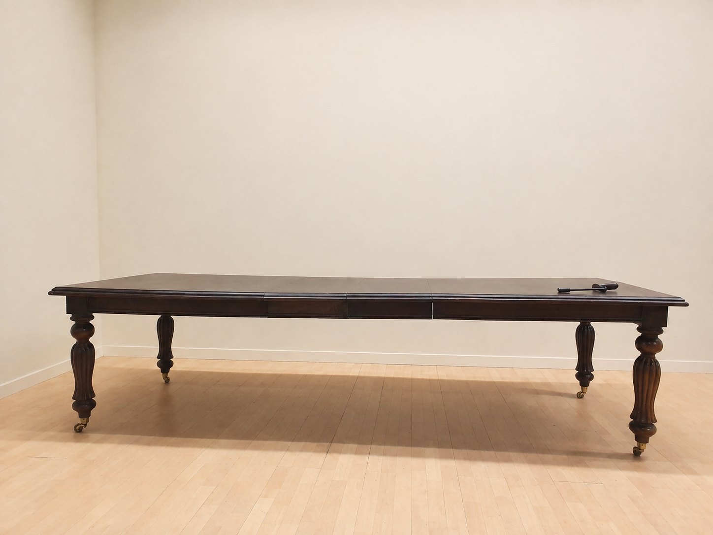 Large extending dining table with turned legs & brass castors — 302×120×77cm, crank included