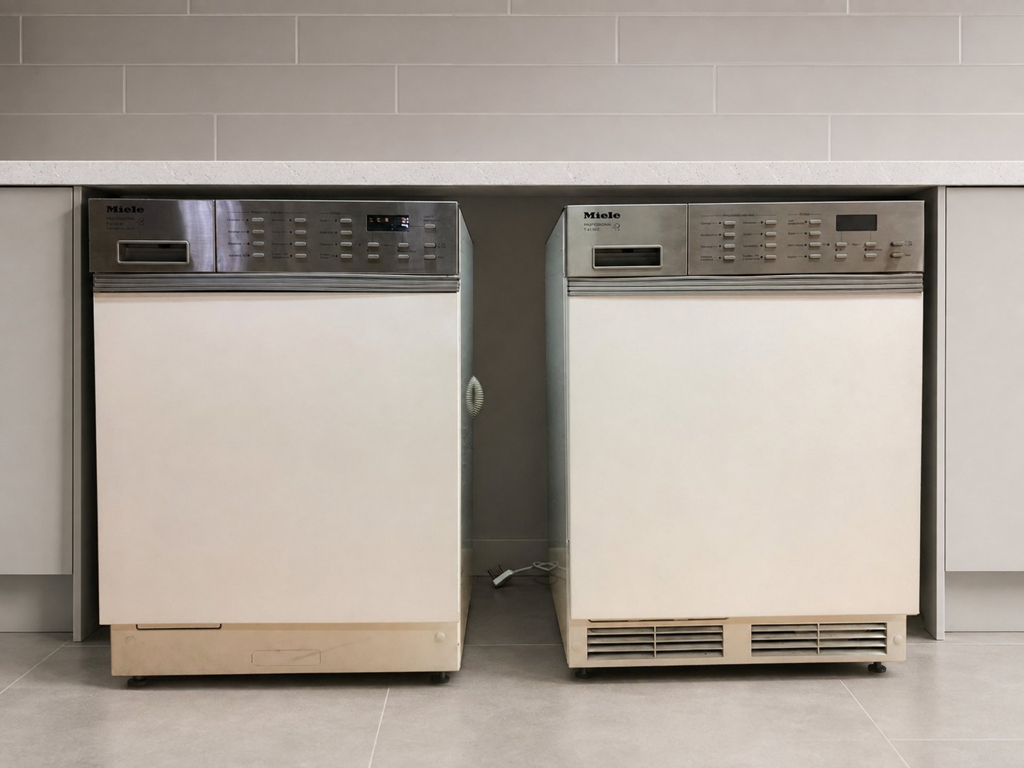 Lot: Pair of Miele built‑in laundry appliances — W 2839 front‑load washer + T 4839 Ci tumble dryer (tested, includes cables & hoses)
