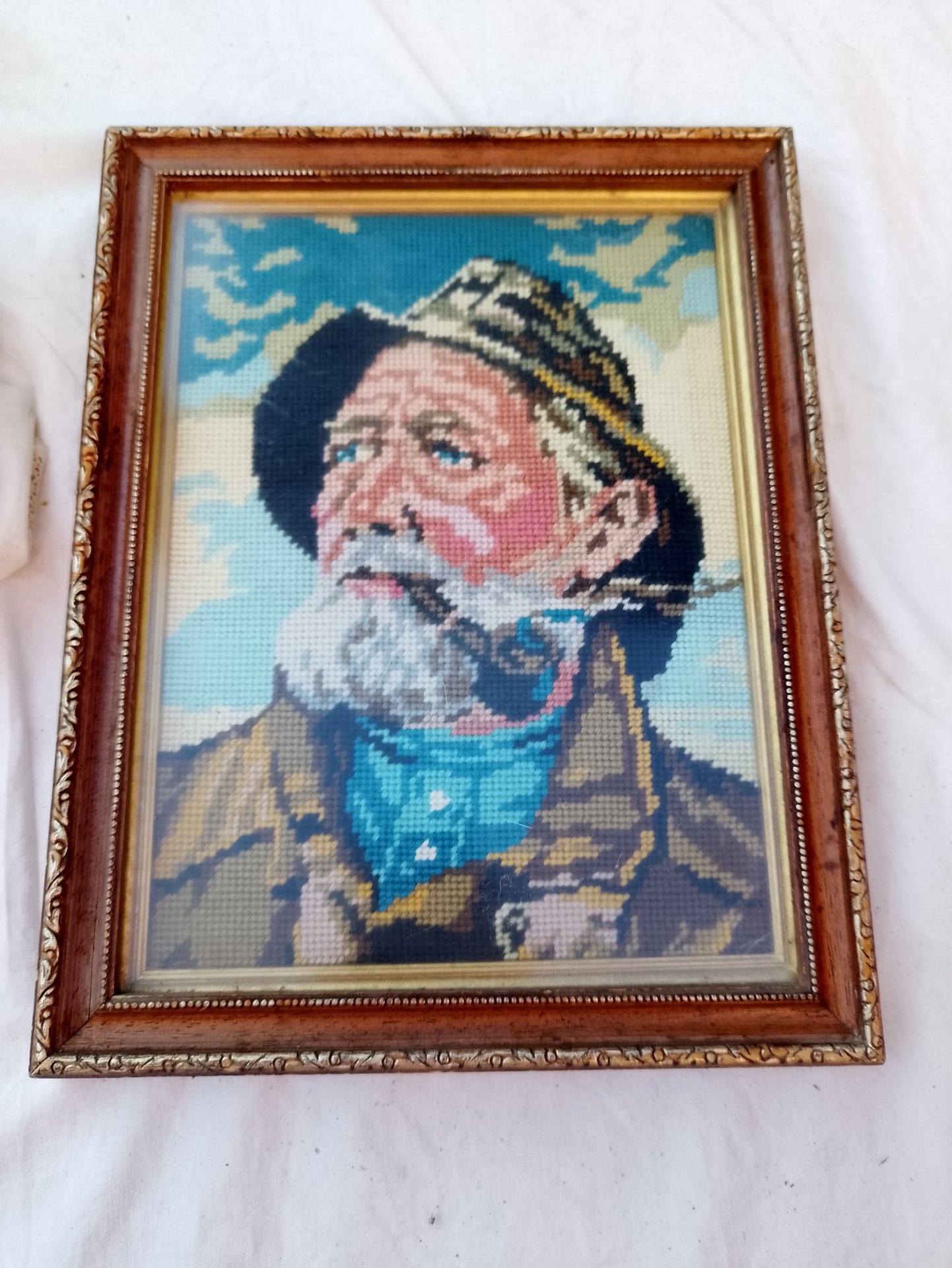 Framed glazed needlepoint portrait of bearded fisherman — 28 x 35 x 2 cm (H x W x D)